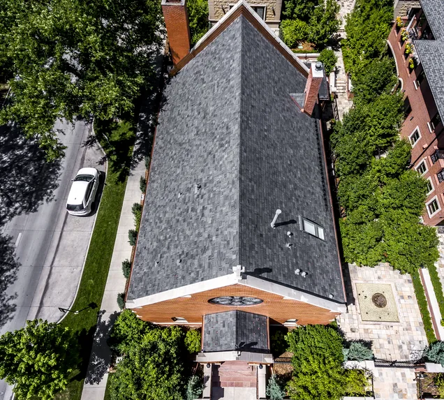 Core Roofing Systems technician inspecting a commercial roof in Denver