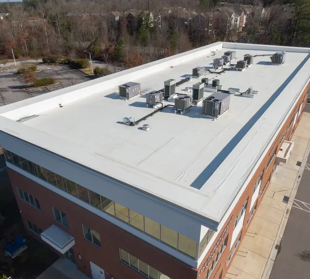 Core Roofing Systems crew installing TPO roofing on a commercial building in Denver