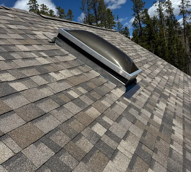 Core Roofing Systems crew installing a skylight on a Denver home