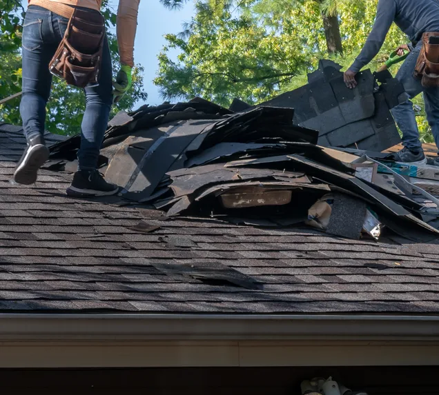 Core Roofing Systems technician documenting storm damage on a Denver multifamily property