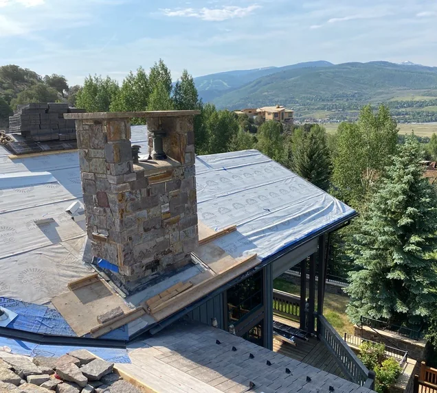 Core Roofing Systems technician documenting storm damage for insurance claim in Denver
