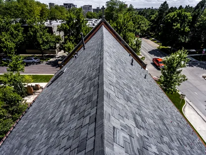 Core Roofing Systems inspector examining commercial roof membrane in Denver