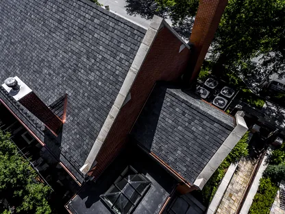 Commercial roof installation equipment and materials on a Denver jobsite