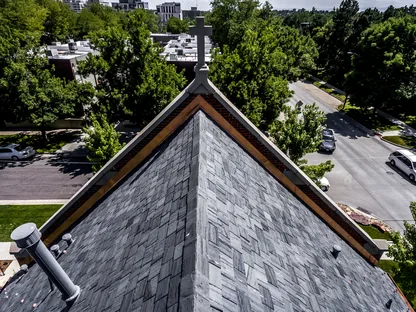Hail damage assessment on a residential roof in Denver
