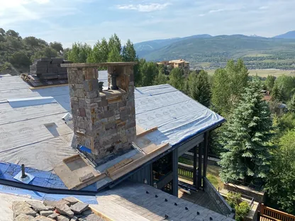 Core Roofing Systems crew performing emergency roof repair on a multifamily building in Denver