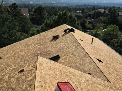 Close-up of shingle repair work being performed by Core Roofing Systems in Denver